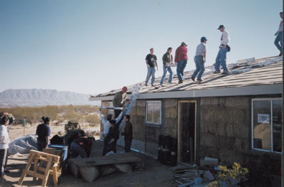 Tierra Madre residents work together to build a straw bale home in New Mexico.